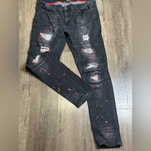 Stylish Black Distressed Jeans with Red Accents